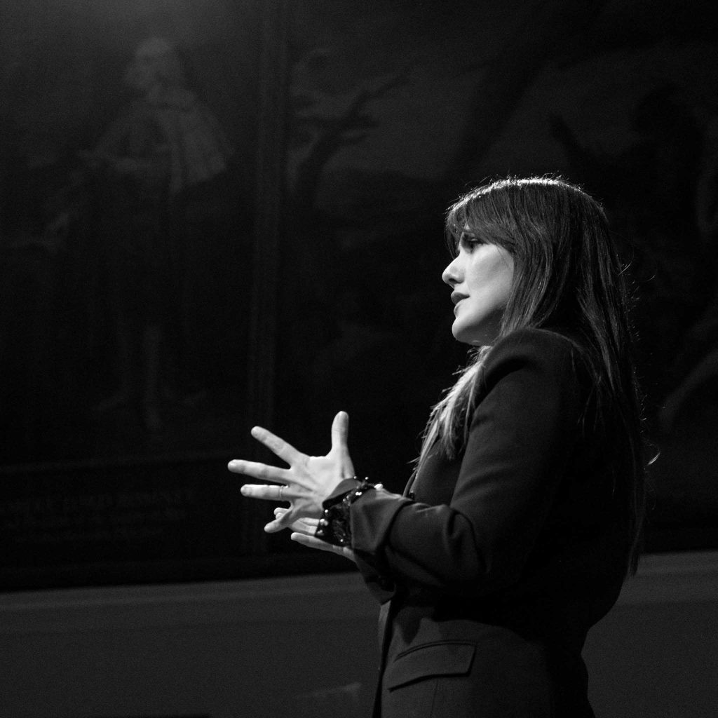 conference speaker giving a presentation in London