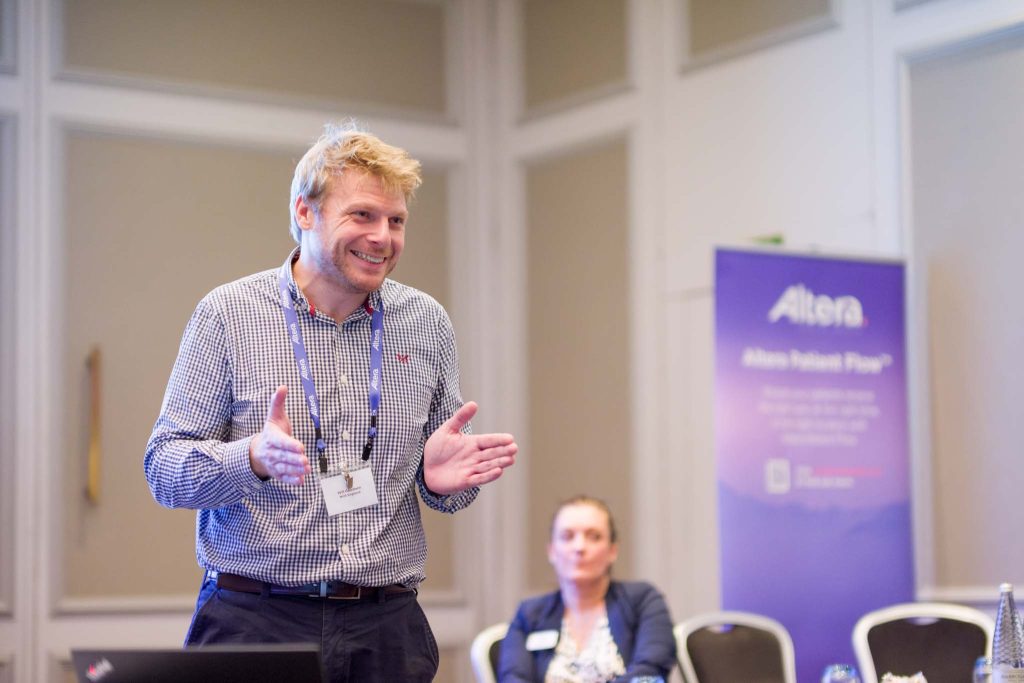 keynote speaking laughing during a presentation. Keynote presentation photography in Birmingham