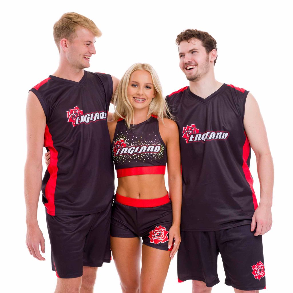 A group of 3 dancers wearing England cheer outfits laughing for the camera. Cheerleading outfits and dance wear apparel photography.