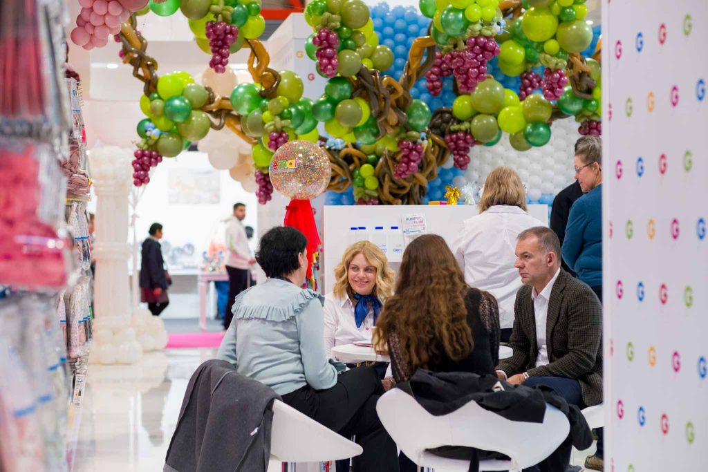 brand representatives speaking to clients at a trade show. Corporate photography Birmingham