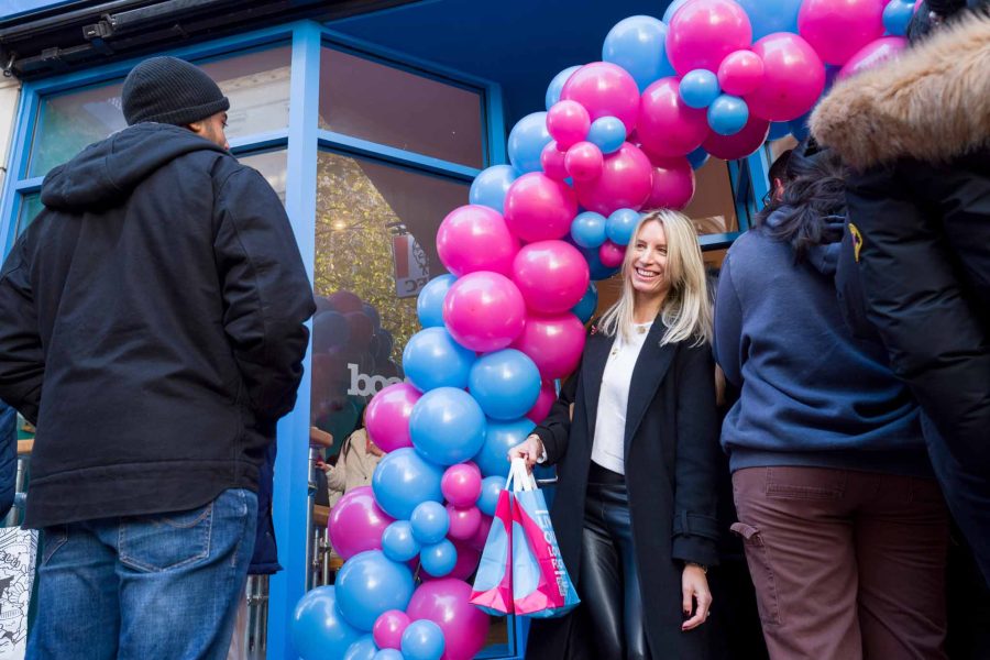 restaurant opening day event, happy customer leaving the building with branded bags